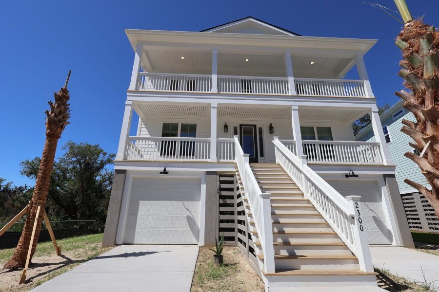 Front exterior of a new home in Liberty Hill Farm, Mount Pleasant, SC, highlighting curb appeal (Image 23). Front exterior of a new home in Liberty Hill Farm, Mount Pleasant, SC, highlighting curb appeal (Image 23).