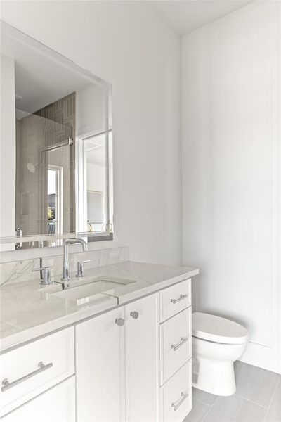 Vanity with a light-toned countertop and an undermount sink