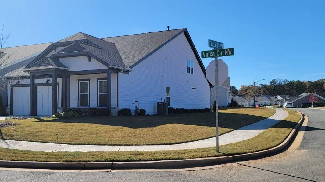 Front exterior of a new home in The Reserve at Bells Ferry, Kennesaw, GA, highlighting curb appeal (Image 1).