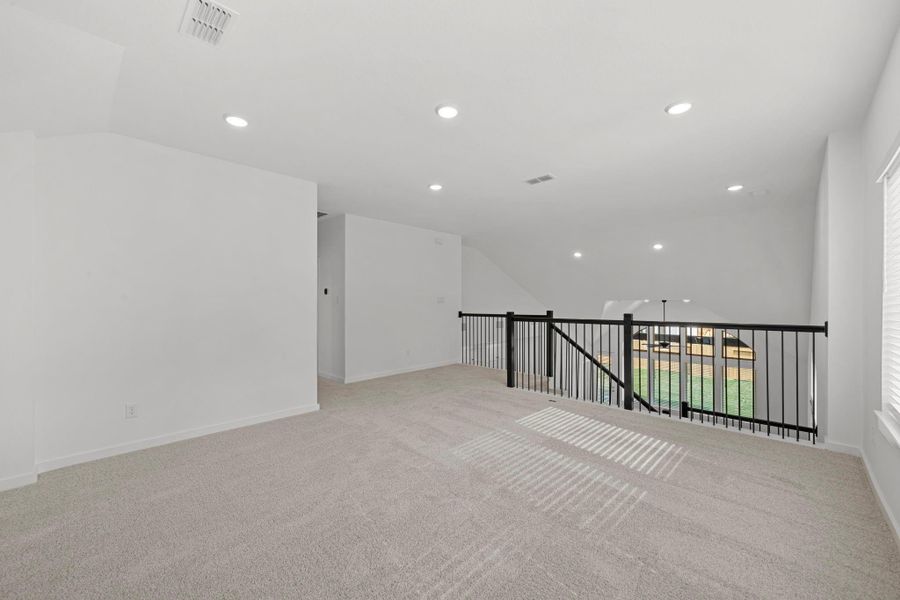 Open-To-Below View Showcasing The High Ceilings And Open Railings