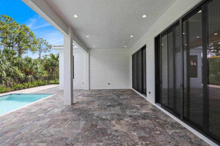Exterior details and patio area of a home in Artistry Palm Beach, Palm Beach Gardens (Image 3).