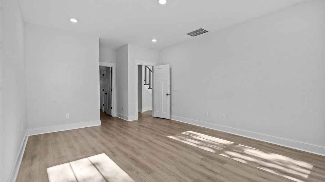 First-class hardwood floors and tasteful finishes elevate the private retreat of this exceptional primary suite First-class hardwood floors and tasteful finishes elevate the private retreat of this exceptional primary suite