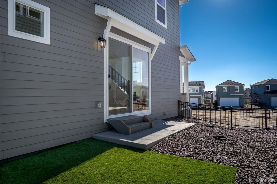 Exterior details and patio area of a home in Revel Crossing at Wolf Ranch – The Ascent Collection, Colorado Springs (Image 3).