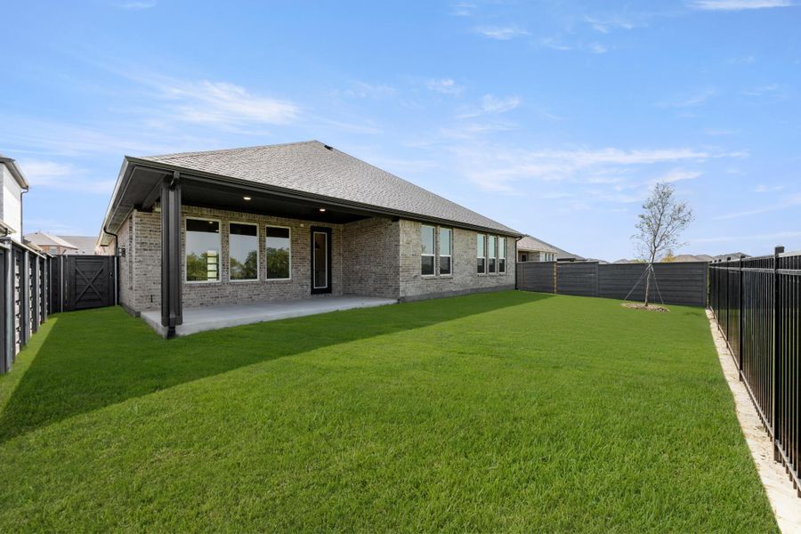 Exterior details and patio area of a home in Inspiration Collection at Union Park, Little Elm (Image 18).