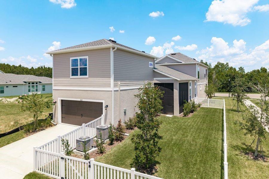 Front exterior of a new home in , Wesley Chapel, FL, highlighting curb appeal (Image 22).