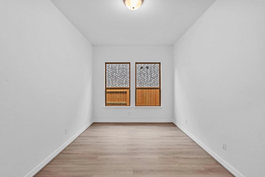 Private study with French doors, beautiful flooring, and large windows—perfect for work, creativity, and peace.