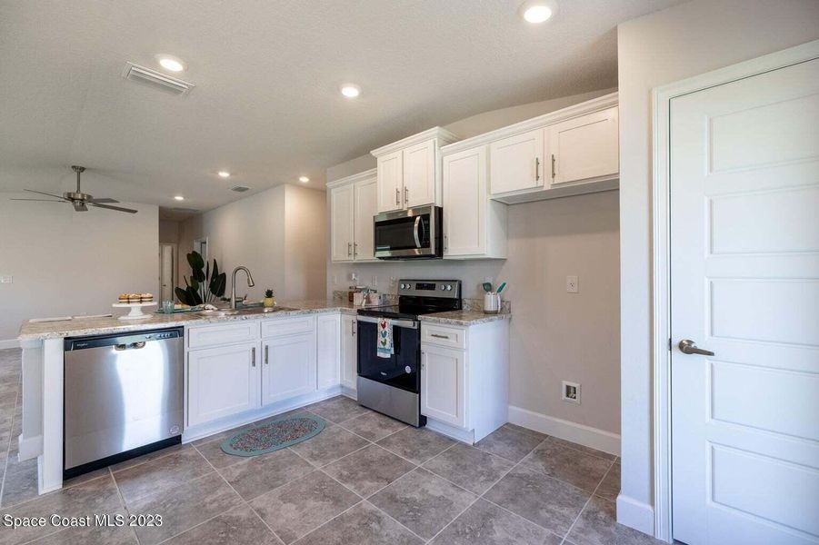 Representative furnished interior of a home built from the 1415 by Adams Homes in Winding Oaks, Weeki Wachee (Image 7).