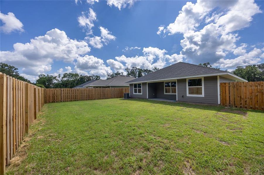 Front exterior of a new home in Savannah Station, Alachua, FL, highlighting curb appeal (Image 9).