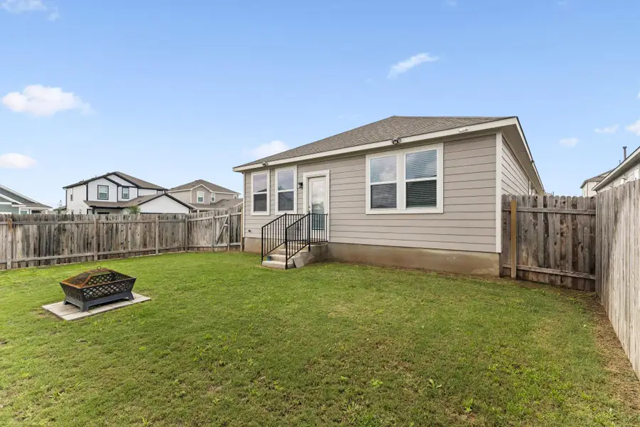 Exterior details and patio area of a home in Stallion Run, Buda (Image 3).