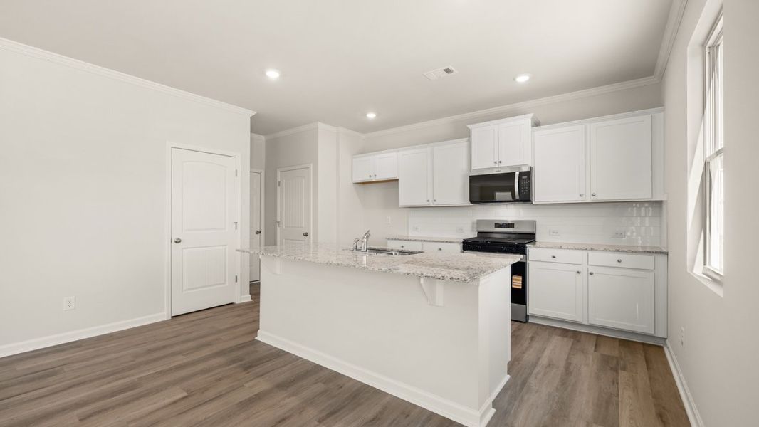 Representative furnished interior of a home built from the Flora by D.R. Horton in Sheffield Highlands, Dallas (Image 9).