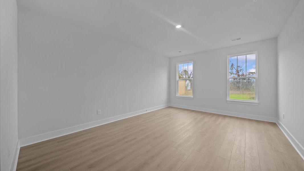 First-class hardwood floors and tasteful finishes elevate the private retreat of this exceptional primary suite First-class hardwood floors and tasteful finishes elevate the private retreat of this exceptional primary suite