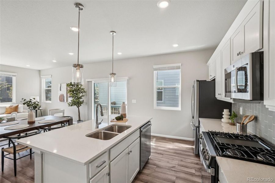 Furnished interior view inside a new home in Woodrose at Painted Prairie, Aurora (Image 8).