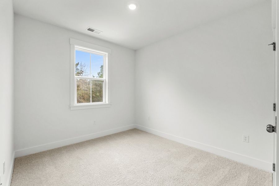 Spacious, unfurnished interior of a new home in Long Bay Golf Club, Longs (Image 22).