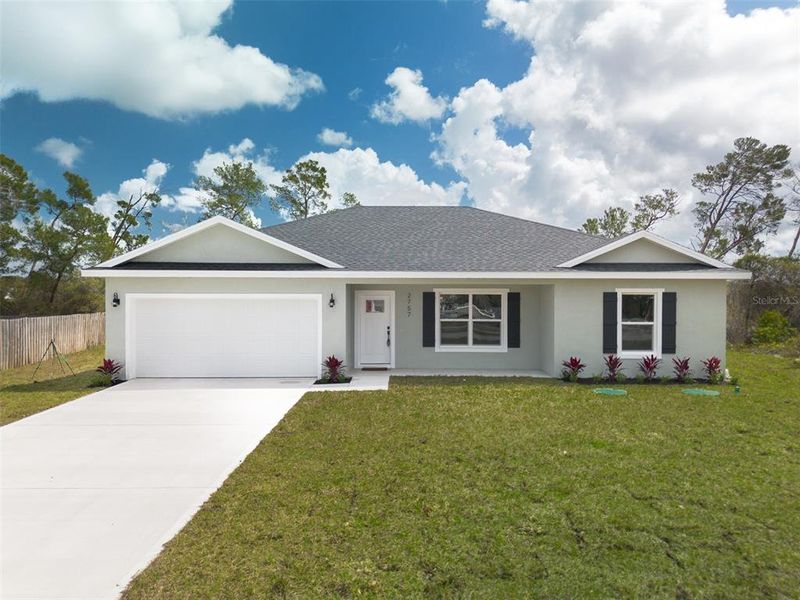 Front exterior of a new home in , Deltona, FL, highlighting curb appeal (Image 15).