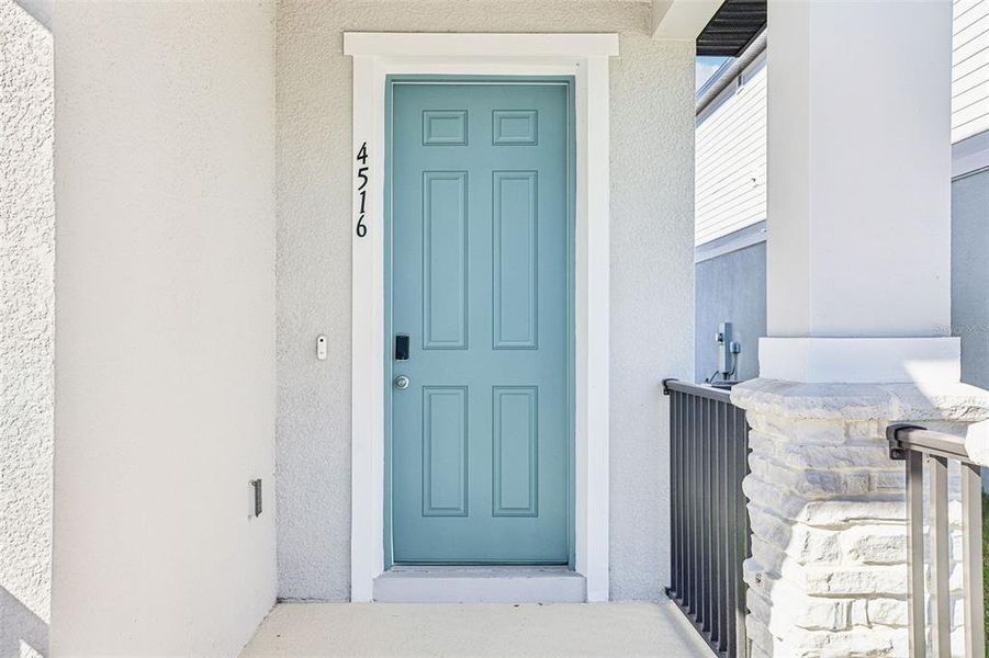 Exterior details and patio area of a home in The Meadow at Crossprairie Bungalows, St. Cloud (Image 3).