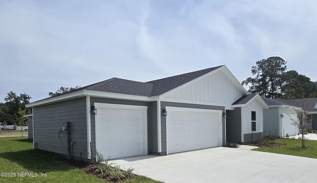 Front exterior of a new home in Azalea Creek, Jacksonville, FL, highlighting curb appeal (Image 1). Front exterior of a new home in Azalea Creek, Jacksonville, FL, highlighting curb appeal (Image 1).
