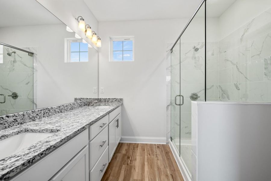 Representative furnished interior of a home built from the Atkinson by UnionMain Homes in Austin Springs, Bethlehem (Image 12).