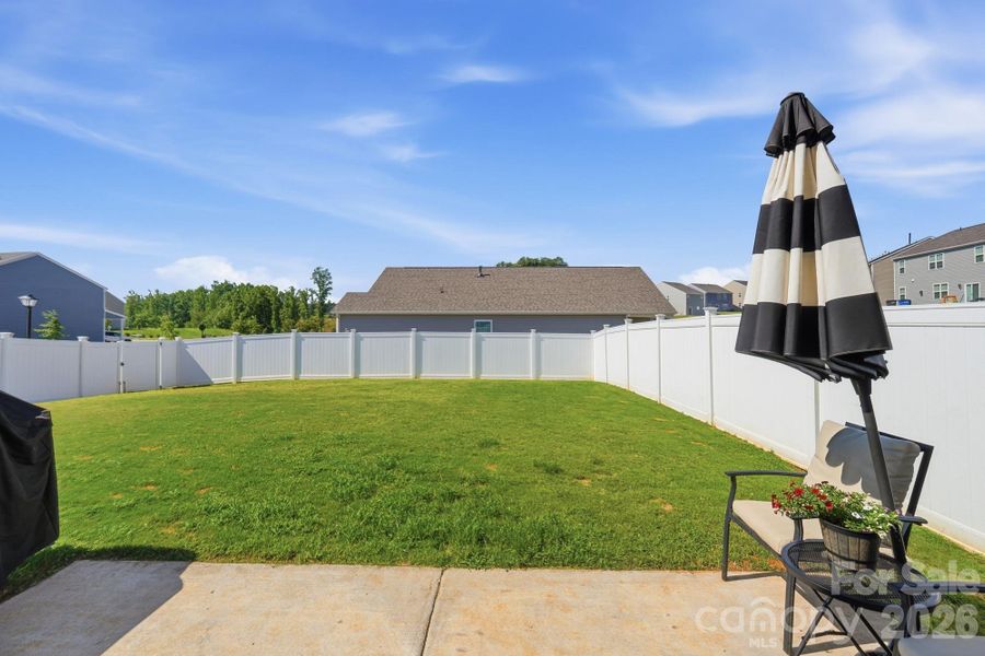 A fully fenced backyard that's already finished and ready for pets, play, and summer evenings. A fully fenced backyard that's already finished and ready for pets, play, and summer evenings.