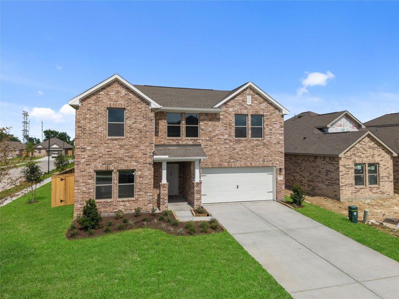 Front exterior of a new home in Windrose Green, Angleton, TX, highlighting curb appeal (Image 2). Front exterior of a new home in Windrose Green, Angleton, TX, highlighting curb appeal (Image 2).