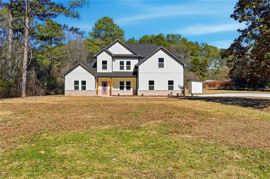 Front exterior of a new home in , Hampton, GA, highlighting curb appeal (Image 1). Front exterior of a new home in , Hampton, GA, highlighting curb appeal (Image 1).