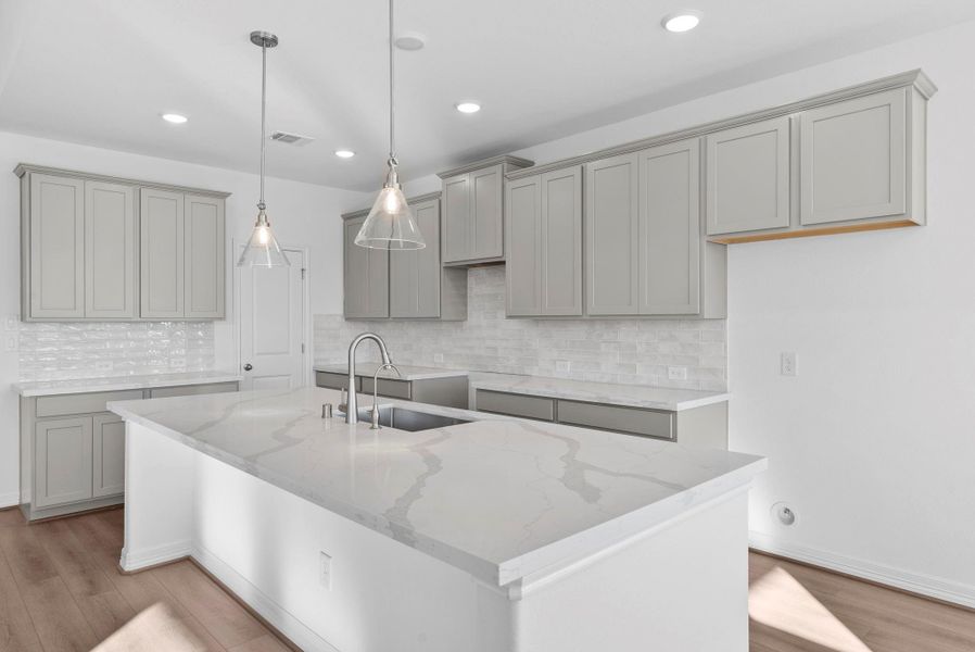 Classic backsplash and pendant lighting!