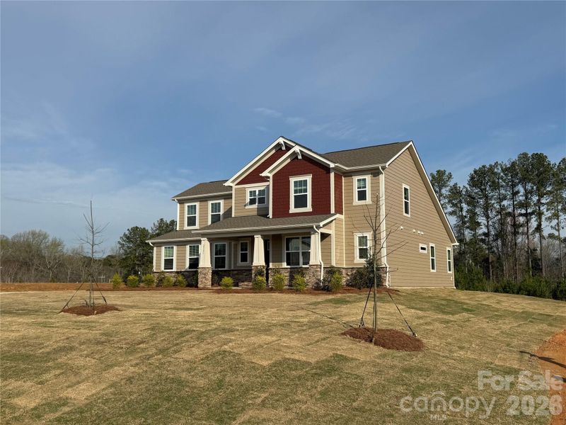 Front exterior of a new home in Blair Place, Monroe, NC, highlighting curb appeal (Image 3). Front exterior of a new home in Blair Place, Monroe, NC, highlighting curb appeal (Image 3).
