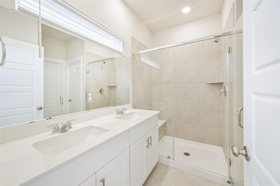 The primary bathroom suite has a power shower and dual vanity. The primary bathroom suite has a power shower and dual vanity.
