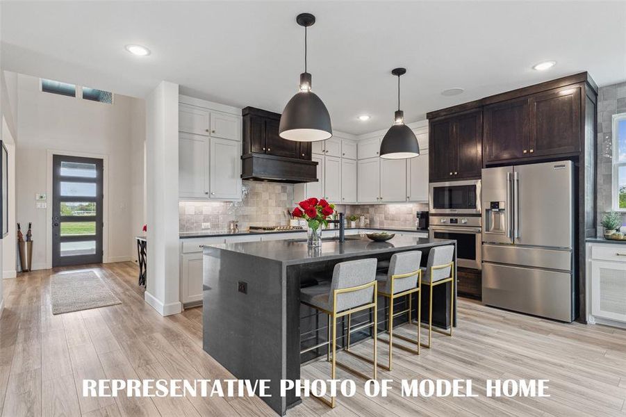 We offer dream kitchens that any chef would be proud to call their own in all of our homes in Windsong Ranch!  REPRESENTATIVE PHOTO OF MODEL HOME