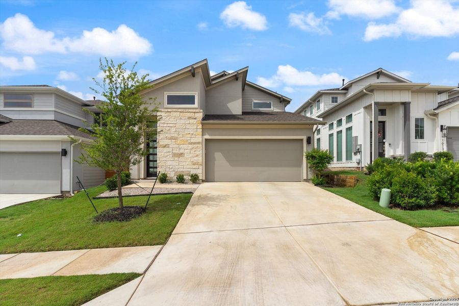 Front exterior of a new home in , Pflugerville, TX, highlighting curb appeal (Image 22).
