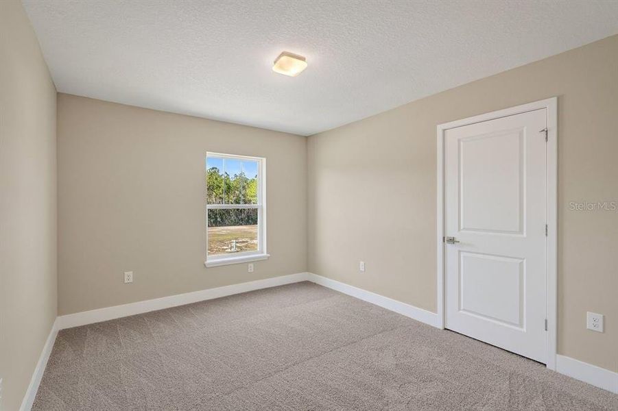 Spacious, unfurnished interior of a new home in Gray Hawk at Hole Two, Daytona Beach (Image 36).