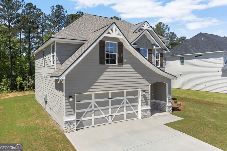 Front exterior of a new home in Juliette Crossing, Forsyth, GA, highlighting curb appeal (Image 29).