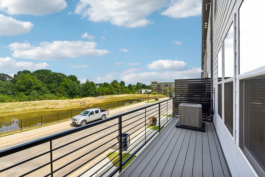 Exterior details and patio area of a home in Indian Trail Townhomes, Indian Trail (Image 3).