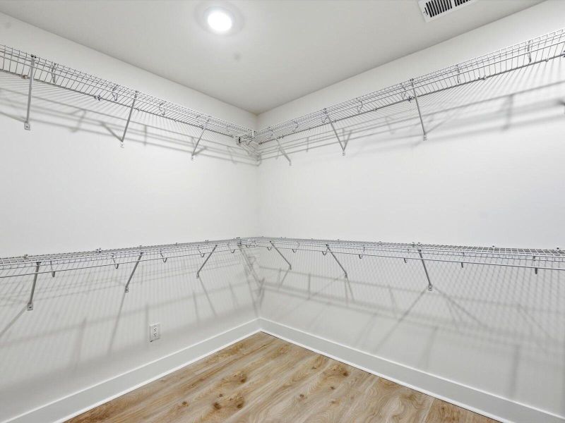 Spacious, unfurnished interior of a new home in The Coves at Lakes of Cane Bay II, Summerville (Image 26).