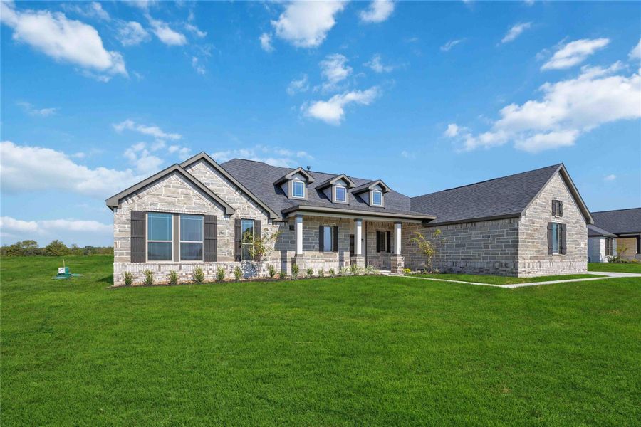 Front exterior of a new home in Blue Heron Estates, Beasley, TX, highlighting curb appeal (Image 2).
