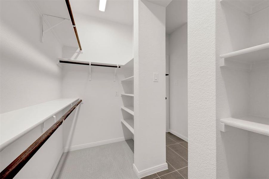 Walk in closet featuring light tile patterned floors
