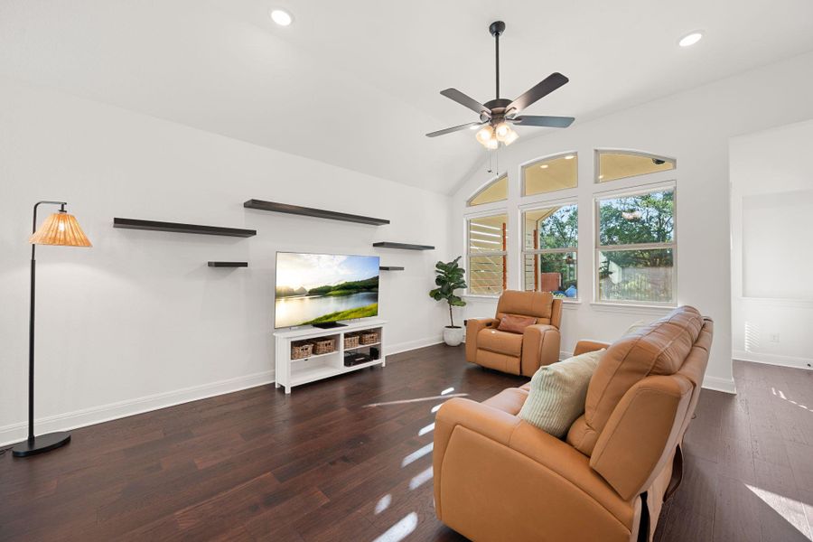 Hard surfaced floors and vaulted ceilings elevate this sun-drenched living space, offering an inviting atmosphere for relaxation. Hard surfaced floors and vaulted ceilings elevate this sun-drenched living space, offering an inviting atmosphere for relaxation.