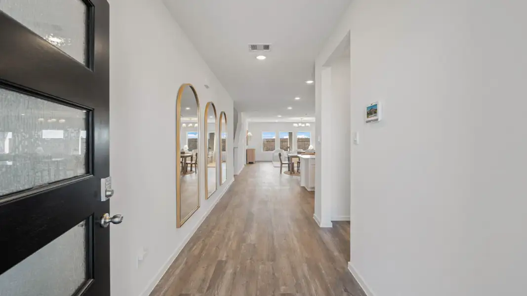 Furnished interior view inside a new home in East Williams Cove, Conroe (Image 3).