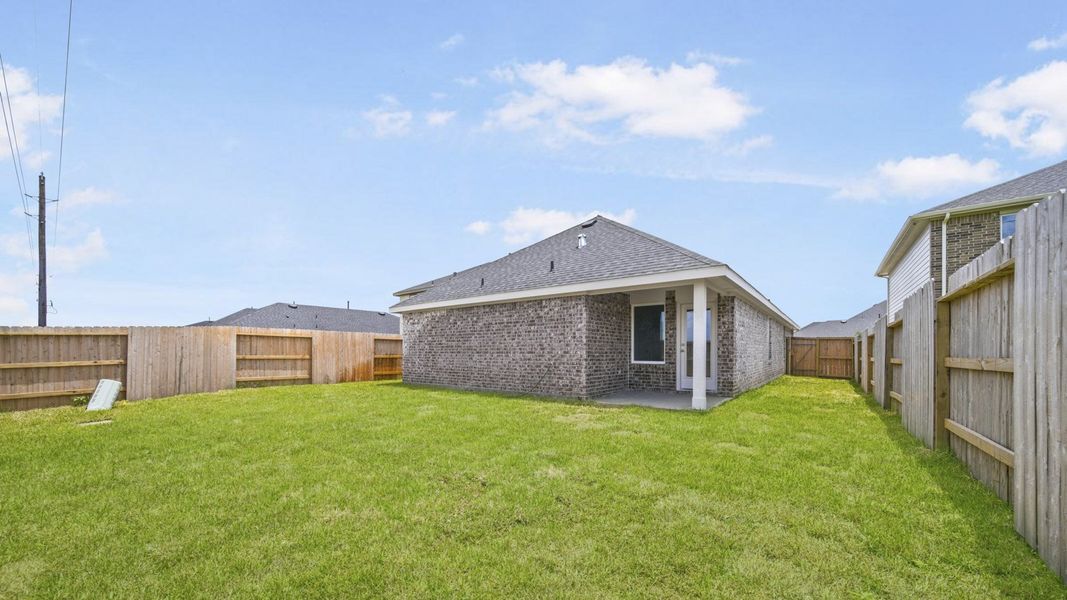 Exterior details and patio area of a home in Sunterra, Katy (Image 20).