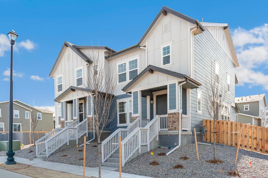 Front exterior of a new home in Turnberry Villas, Commerce City, CO, highlighting curb appeal (Image 1). Front exterior of a new home in Turnberry Villas, Commerce City, CO, highlighting curb appeal (Image 1).