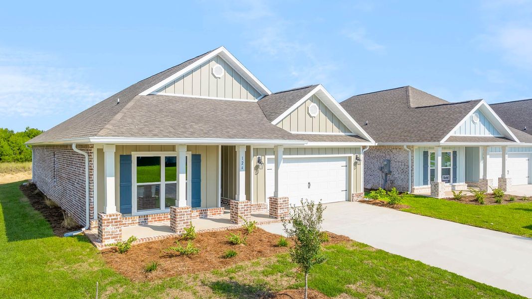 Front exterior of a new home in Owl's Head Farms, Freeport, FL, highlighting curb appeal (Image 2). Front exterior of a new home in Owl's Head Farms, Freeport, FL, highlighting curb appeal (Image 2).