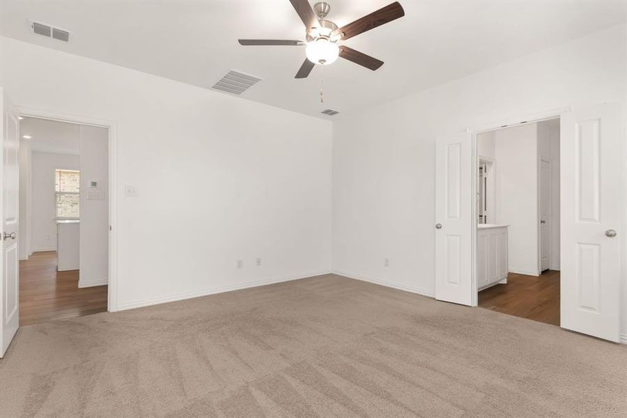 another view of primary bedroom to show how large of space this is