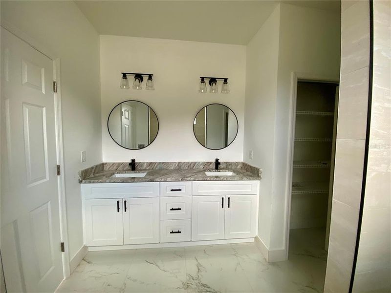 master bath, double granite vanity top & lien closet