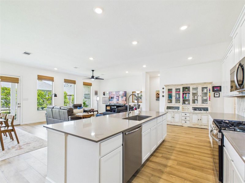 This view of the kitchen, dining and living room shows the functionality and openness at the heart of the home.