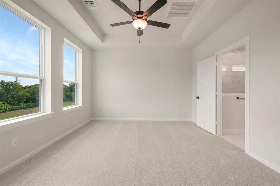 Neutral-toned wall-to-wall carpeting complements the light wall color Neutral-toned wall-to-wall carpeting complements the light wall color
