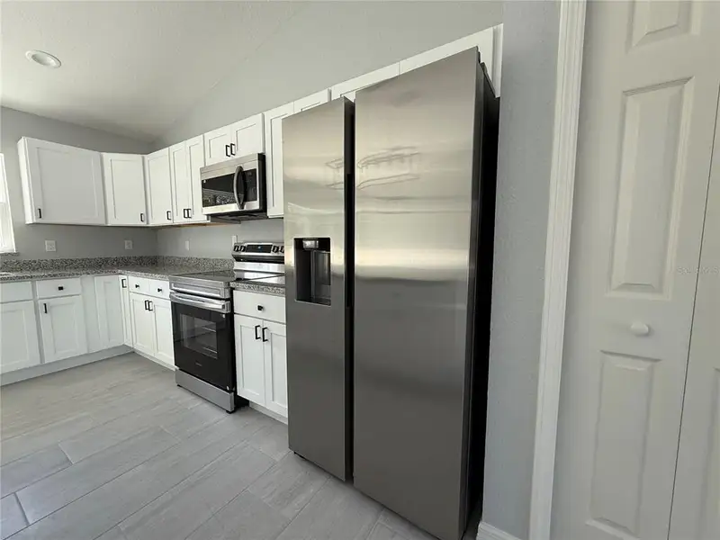 Furnished interior view inside a new home in , Dunnellon (Image 6).