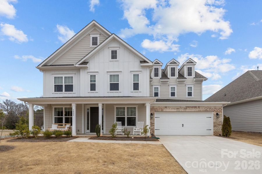 Front exterior of a new home in , Mint Hill, NC, highlighting curb appeal (Image 24).