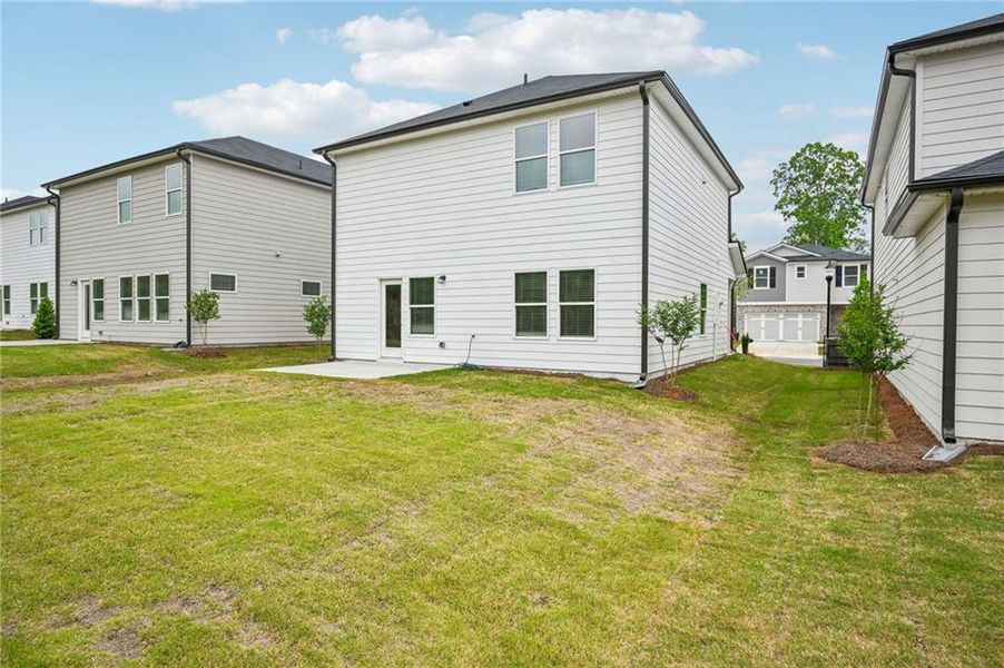 Front exterior of a new home in Hawthorne Station, College Park, GA, highlighting curb appeal (Image 26).