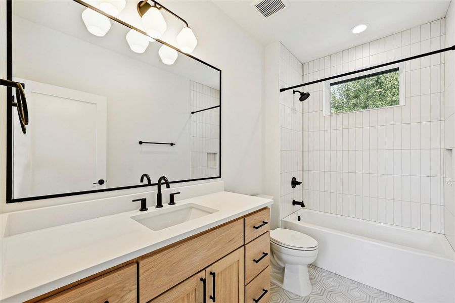Full bath with tub/shower combo and tile floor. Full bath with tub/shower combo and tile floor.