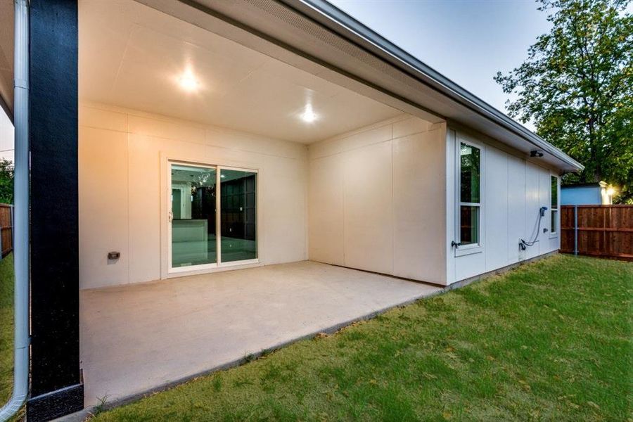 Large covered porch with sliding door