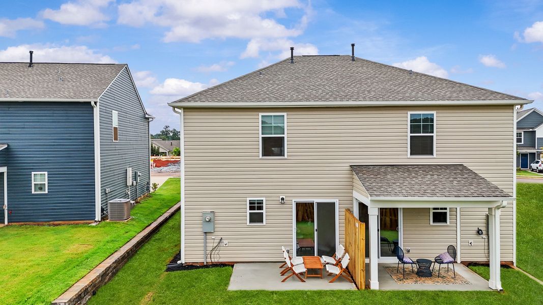 Exterior details and patio area of a home in Champions Village at Cherry Hill, Pendleton (Image 32).